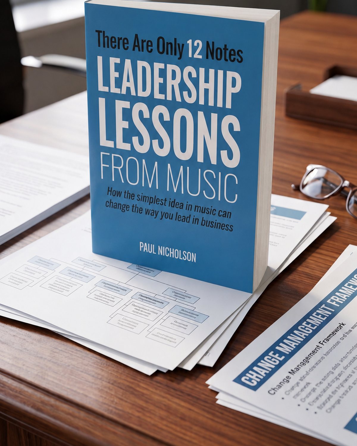 There Are Only 12 Notes paperback standing on a desk among leadership frameworks